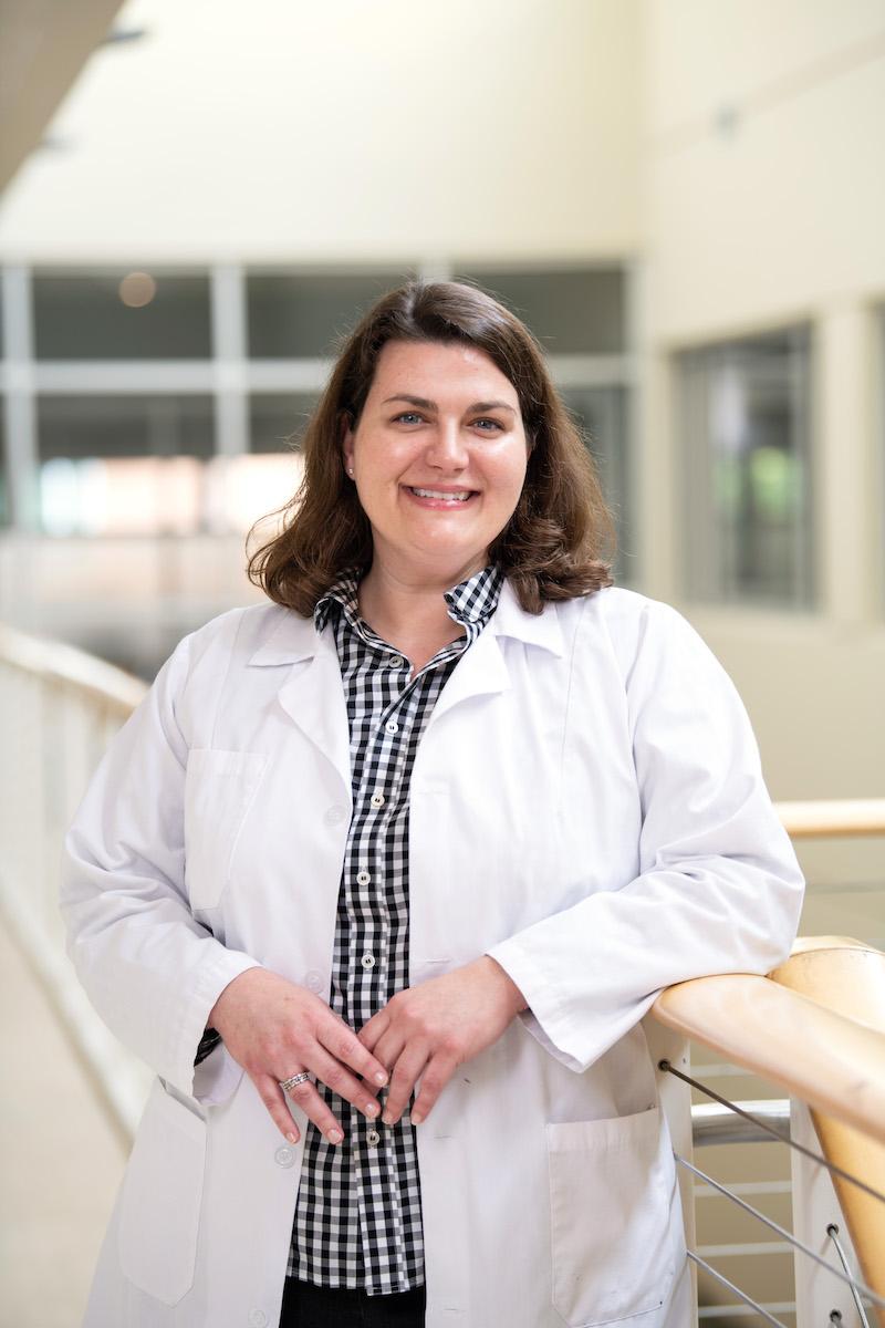 A nursing student smiles for a photo.